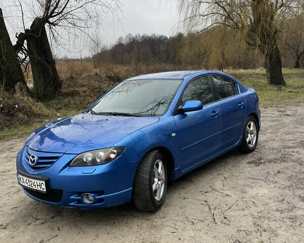 Синий Мазда 3, объемом двигателя 2 л и пробегом 200 тыс. км за 3900 $, фото 2 на Automoto.ua