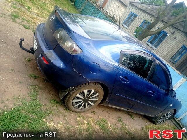 Синий Мазда 3, объемом двигателя 2 л и пробегом 255 тыс. км за 3200 $, фото 5 на Automoto.ua