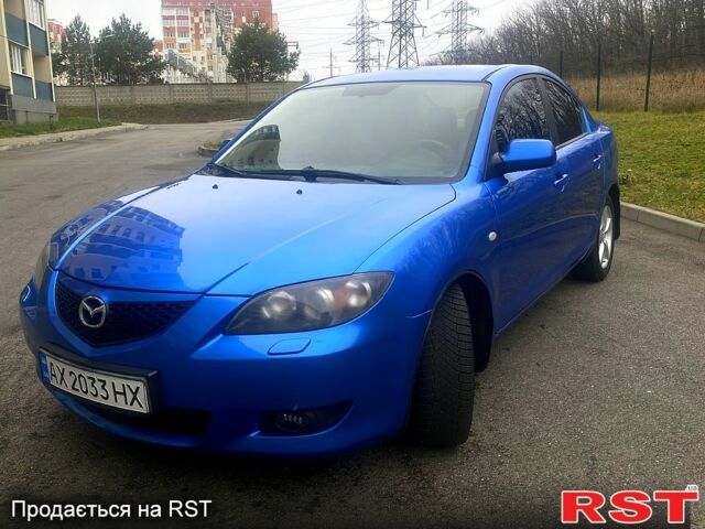 Синий Мазда 3, объемом двигателя 1.6 л и пробегом 255 тыс. км за 5200 $, фото 1 на Automoto.ua
