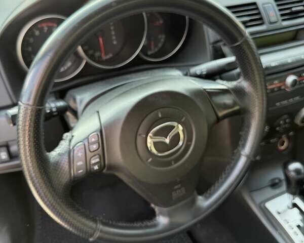 Синий Мазда 3, объемом двигателя 1.6 л и пробегом 198 тыс. км за 2800 $, фото 10 на Automoto.ua