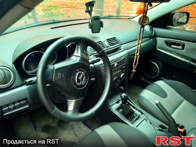 Синий Мазда 3, объемом двигателя 2 л и пробегом 258 тыс. км за 4500 $, фото 1 на Automoto.ua