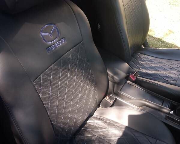 Синій Мазда 3, об'ємом двигуна 1.6 л та пробігом 213 тис. км за 4800 $, фото 13 на Automoto.ua
