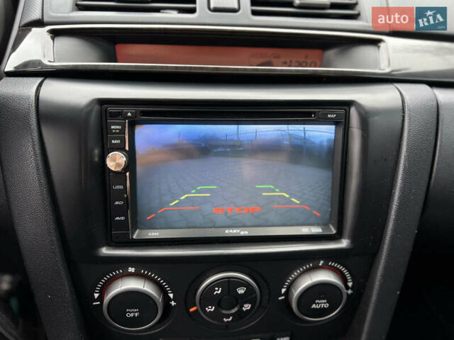 Синій Мазда 3, об'ємом двигуна 1.6 л та пробігом 175 тис. км за 5300 $, фото 31 на Automoto.ua