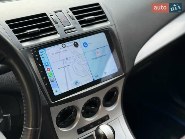 Синий Мазда 3, объемом двигателя 1.6 л и пробегом 206 тыс. км за 7500 $, фото 13 на Automoto.ua