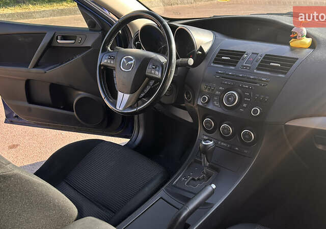 Синий Мазда 3, объемом двигателя 2 л и пробегом 180 тыс. км за 7700 $, фото 3 на Automoto.ua