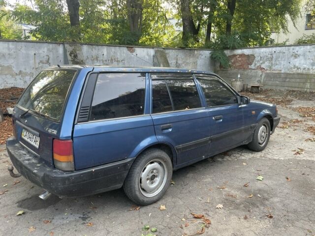 Синий Мазда 3, объемом двигателя 1.8 л и пробегом 300 тыс. км за 850 $, фото 1 на Automoto.ua
