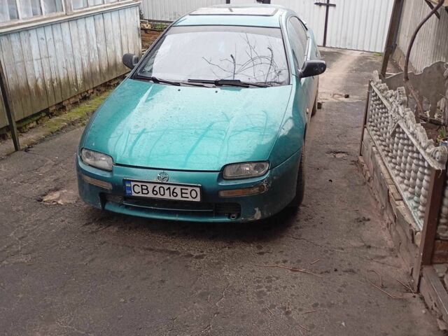 Зеленый Мазда 3, объемом двигателя 1.5 л и пробегом 250 тыс. км за 2000 $, фото 1 на Automoto.ua