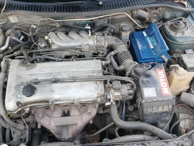 Зелений Мазда 3, об'ємом двигуна 1.8 л та пробігом 257 тис. км за 3100 $, фото 12 на Automoto.ua