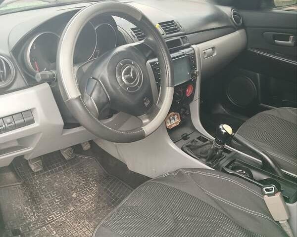 Зелений Мазда 3, об'ємом двигуна 1.4 л та пробігом 260 тис. км за 3200 $, фото 6 на Automoto.ua