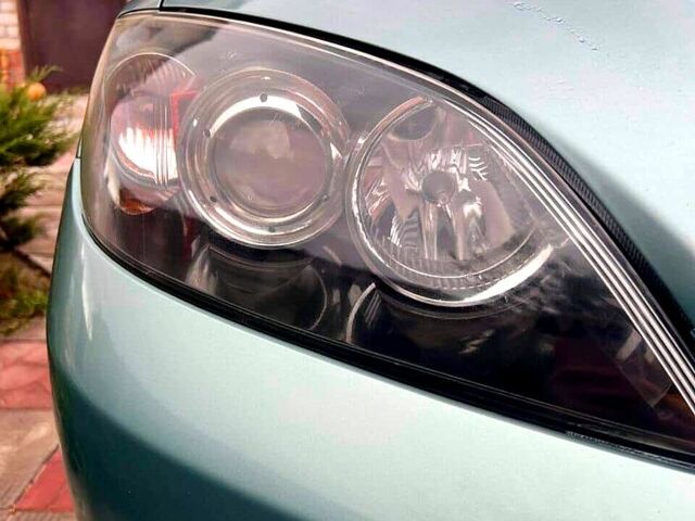 Зеленый Мазда 3, объемом двигателя 1.6 л и пробегом 227 тыс. км за 4500 $, фото 8 на Automoto.ua