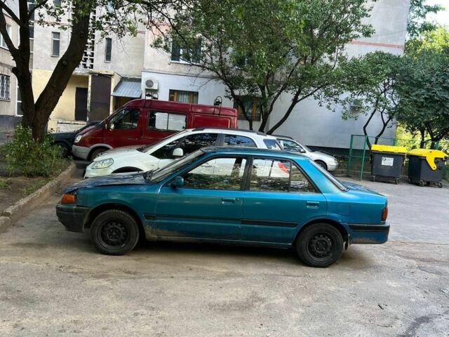 Зеленый Мазда 3, объемом двигателя 1 л и пробегом 420 тыс. км за 797 $, фото 4 на Automoto.ua