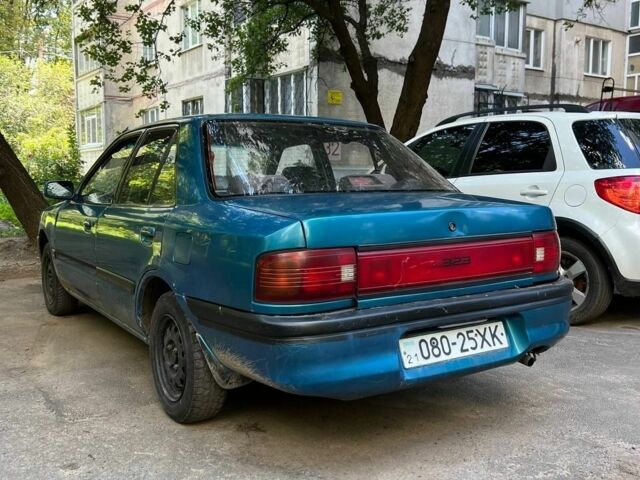 Зеленый Мазда 3, объемом двигателя 1 л и пробегом 420 тыс. км за 797 $, фото 5 на Automoto.ua