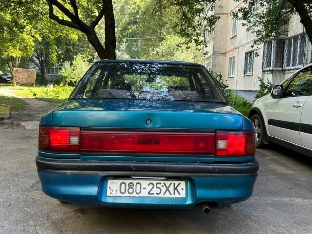 Зеленый Мазда 3, объемом двигателя 1 л и пробегом 420 тыс. км за 797 $, фото 6 на Automoto.ua