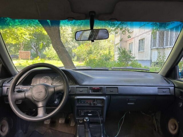 Зеленый Мазда 3, объемом двигателя 1 л и пробегом 420 тыс. км за 797 $, фото 3 на Automoto.ua