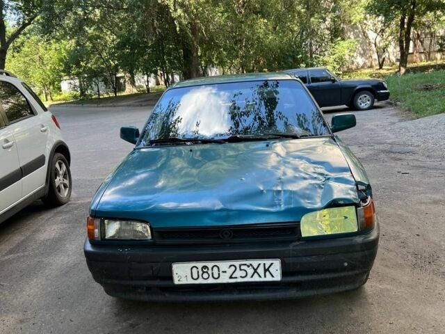 Зеленый Мазда 3, объемом двигателя 1 л и пробегом 420 тыс. км за 797 $, фото 7 на Automoto.ua