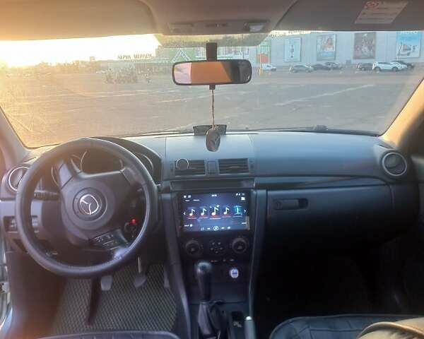 Зеленый Мазда 3, объемом двигателя 2 л и пробегом 177 тыс. км за 5600 $, фото 5 на Automoto.ua