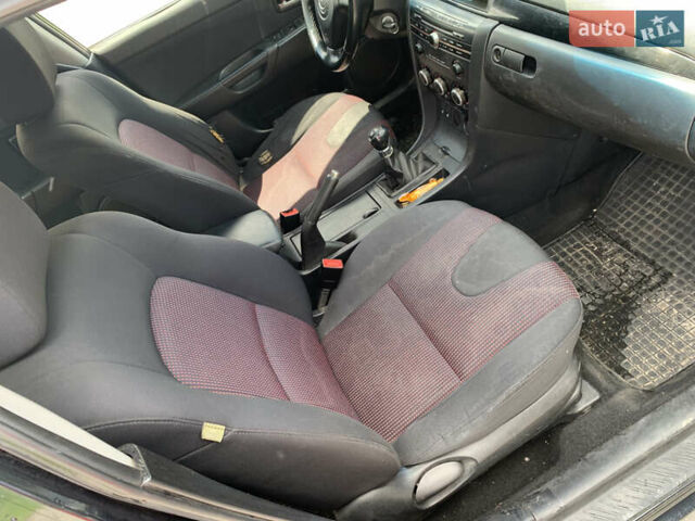 Зелений Мазда 3, об'ємом двигуна 1.6 л та пробігом 375 тис. км за 3300 $, фото 6 на Automoto.ua