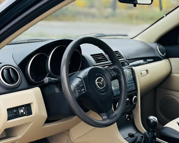 Зеленый Мазда 3, объемом двигателя 2 л и пробегом 253 тыс. км за 4300 $, фото 7 на Automoto.ua