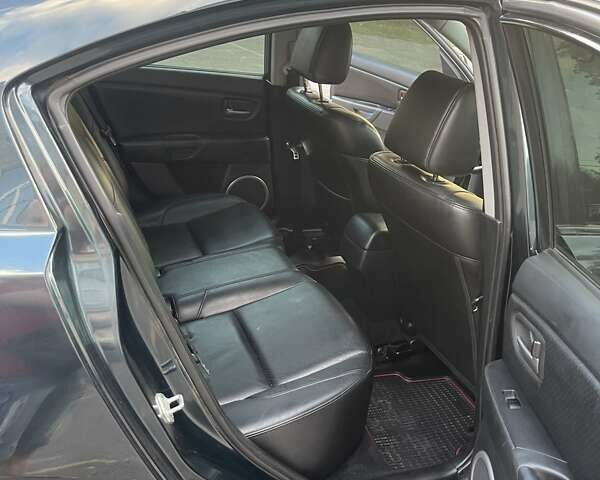 Зеленый Мазда 3, объемом двигателя 1.6 л и пробегом 155 тыс. км за 6099 $, фото 8 на Automoto.ua