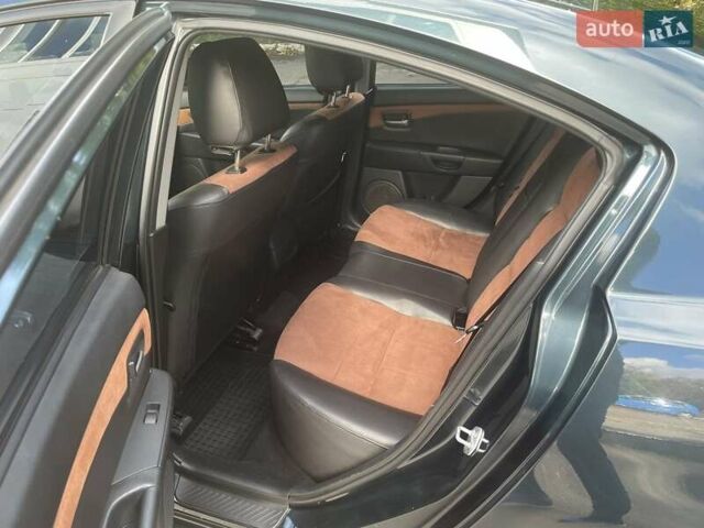 Зеленый Мазда 3, объемом двигателя 2 л и пробегом 176 тыс. км за 5700 $, фото 14 на Automoto.ua