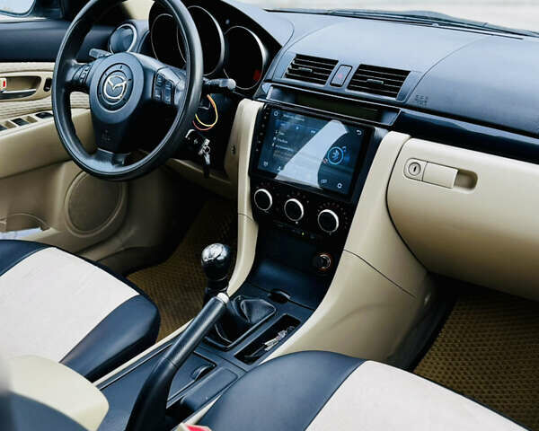 Зеленый Мазда 3, объемом двигателя 2 л и пробегом 253 тыс. км за 4300 $, фото 8 на Automoto.ua
