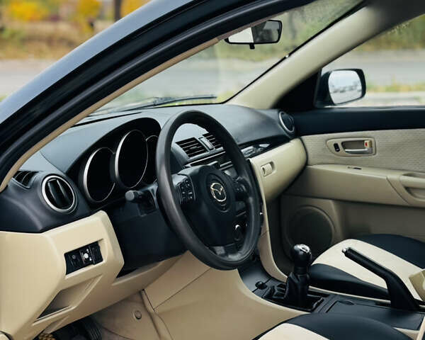 Зеленый Мазда 3, объемом двигателя 2 л и пробегом 253 тыс. км за 4300 $, фото 5 на Automoto.ua