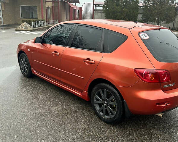 Помаранчевий Мазда 3, об'ємом двигуна 1.6 л та пробігом 198 тис. км за 4400 $, фото 2 на Automoto.ua