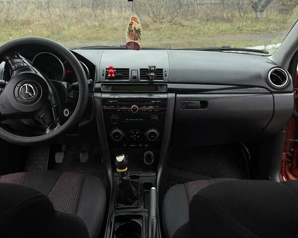 Оранжевый Мазда 3, объемом двигателя 1.6 л и пробегом 260 тыс. км за 4500 $, фото 4 на Automoto.ua