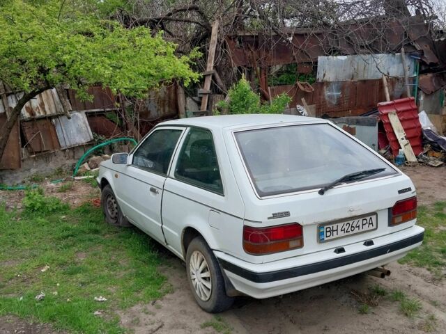 Белый Мазда 323, объемом двигателя 1.5 л и пробегом 350 тыс. км за 502 $, фото 3 на Automoto.ua