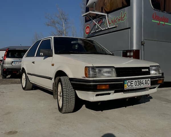 Белый Мазда 323, объемом двигателя 1.3 л и пробегом 300 тыс. км за 1000 $, фото 3 на Automoto.ua