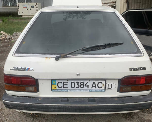 Белый Мазда 323, объемом двигателя 1.3 л и пробегом 300 тыс. км за 1000 $, фото 1 на Automoto.ua