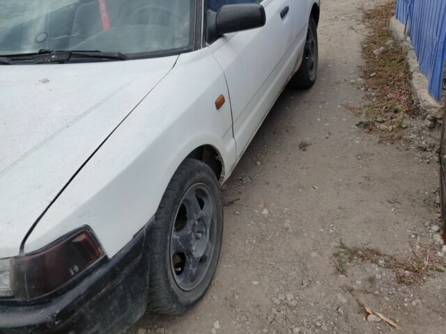 Белый Мазда 323, объемом двигателя 0 л и пробегом 480 тыс. км за 500 $, фото 1 на Automoto.ua