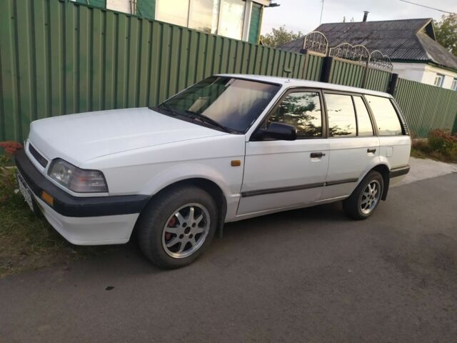 Білий Мазда 323, об'ємом двигуна 1.5 л та пробігом 20 тис. км за 1187 $, фото 2 на Automoto.ua