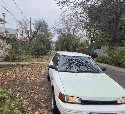 Белый Мазда 323, объемом двигателя 1.6 л и пробегом 298 тыс. км за 1300 $, фото 1 на Automoto.ua