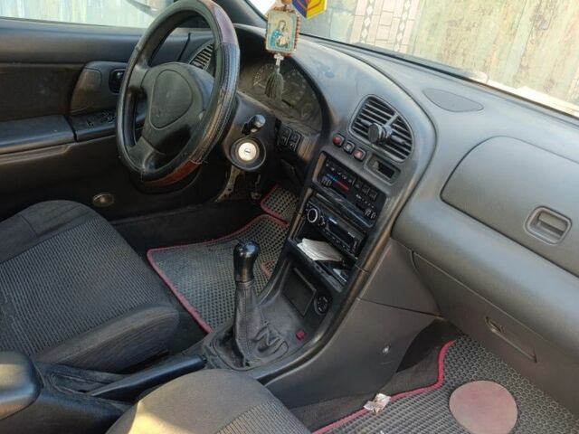 Белый Мазда 323, объемом двигателя 1.5 л и пробегом 380 тыс. км за 1550 $, фото 2 на Automoto.ua