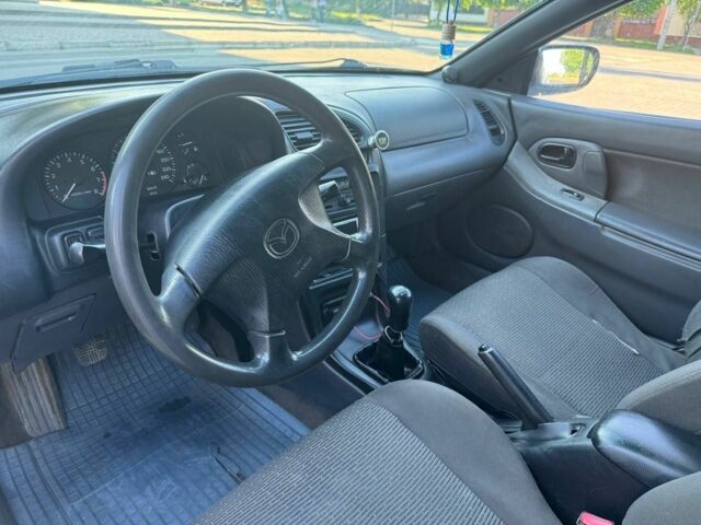 Белый Мазда 323, объемом двигателя 1.5 л и пробегом 445 тыс. км за 3300 $, фото 6 на Automoto.ua