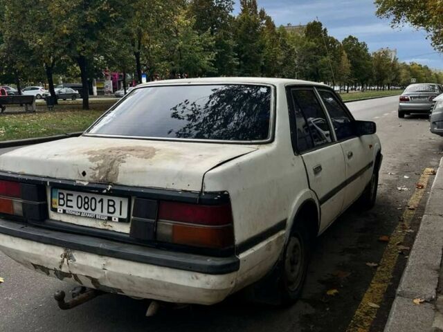 Белый Мазда 323, объемом двигателя 1.8 л и пробегом 2 тыс. км за 476 $, фото 1 на Automoto.ua