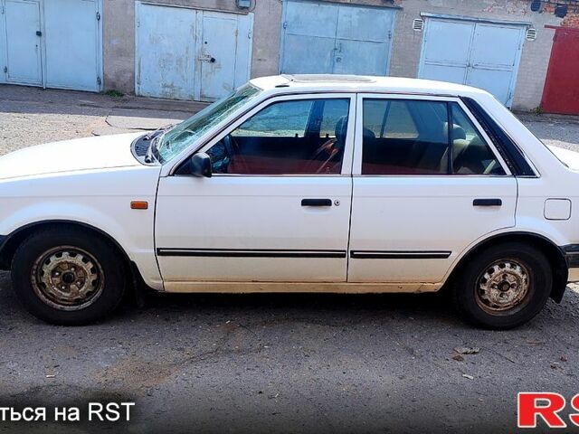 Белый Мазда 323, объемом двигателя 1.3 л и пробегом 888 тыс. км за 800 $, фото 1 на Automoto.ua