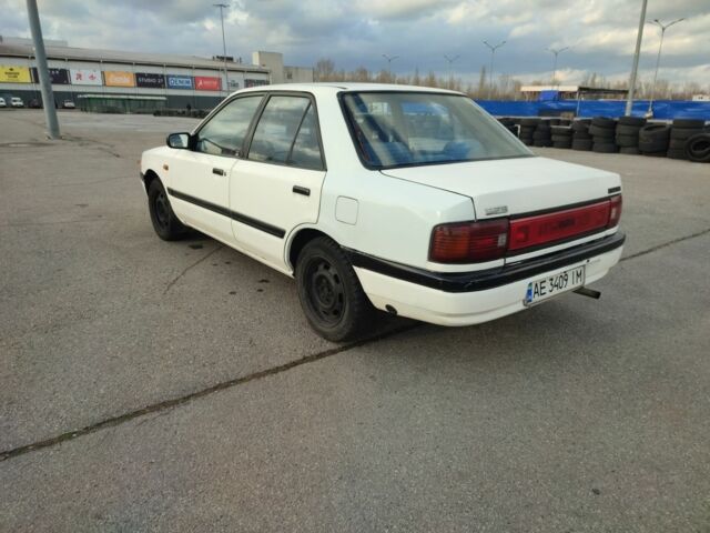 Белый Мазда 323, объемом двигателя 1.5 л и пробегом 315 тыс. км за 1400 $, фото 2 на Automoto.ua