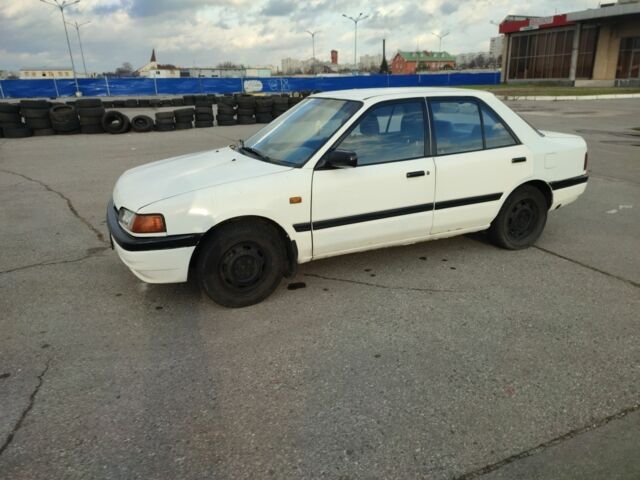 Белый Мазда 323, объемом двигателя 1.5 л и пробегом 315 тыс. км за 1400 $, фото 1 на Automoto.ua