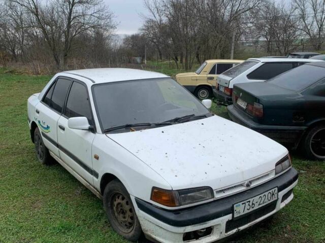 Белый Мазда 323, объемом двигателя 1.7 л и пробегом 300 тыс. км за 850 $, фото 1 на Automoto.ua