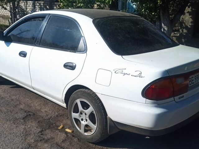 Белый Мазда 323, объемом двигателя 0 л и пробегом 485 тыс. км за 2200 $, фото 2 на Automoto.ua