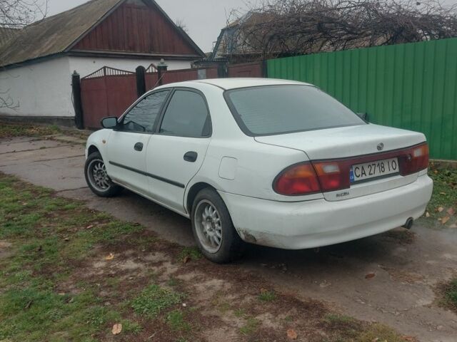 Белый Мазда 323, объемом двигателя 1.5 л и пробегом 330 тыс. км за 1850 $, фото 1 на Automoto.ua