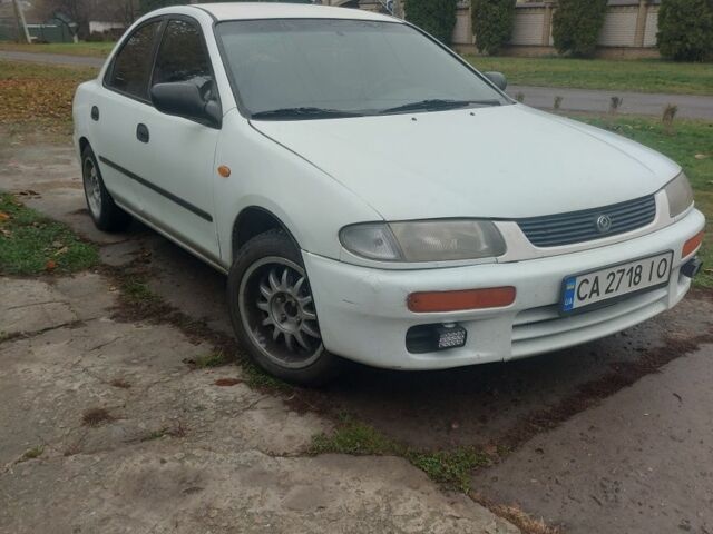 Белый Мазда 323, объемом двигателя 1.5 л и пробегом 330 тыс. км за 1850 $, фото 3 на Automoto.ua