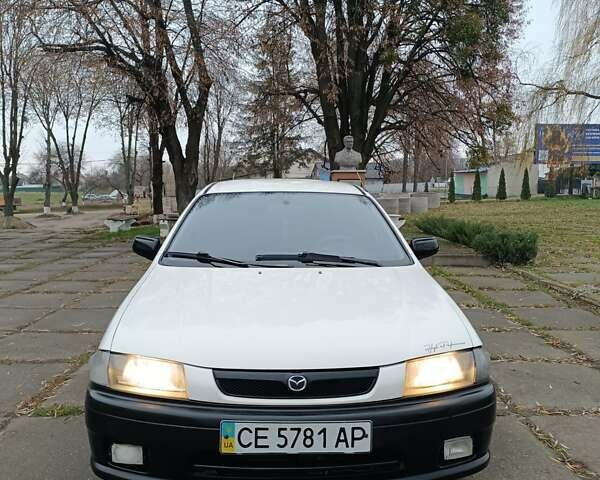 Белый Мазда 323, объемом двигателя 1.5 л и пробегом 420 тыс. км за 2750 $, фото 2 на Automoto.ua