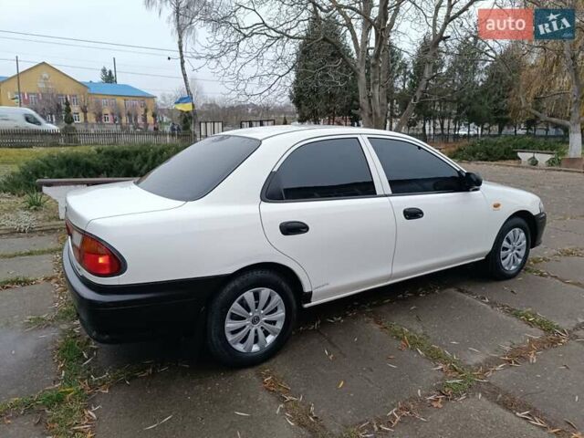 Белый Мазда 323, объемом двигателя 1.5 л и пробегом 420 тыс. км за 2750 $, фото 8 на Automoto.ua