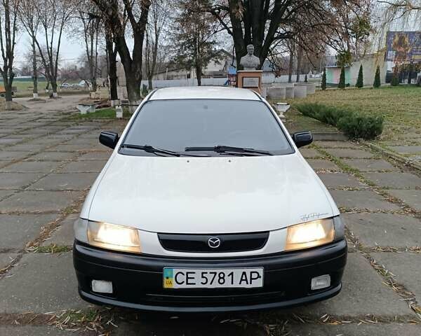 Белый Мазда 323, объемом двигателя 1.5 л и пробегом 420 тыс. км за 2750 $, фото 4 на Automoto.ua