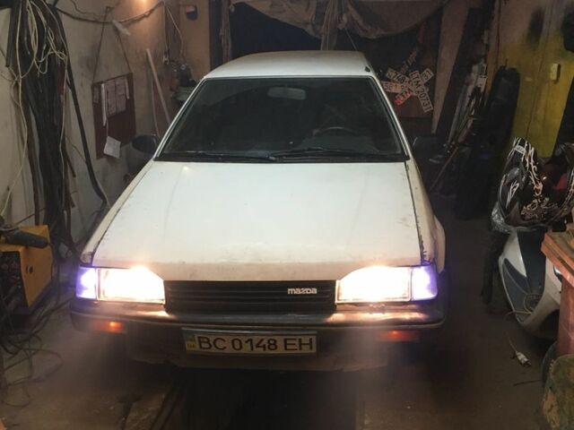 Белый Мазда 323, объемом двигателя 1.7 л и пробегом 300 тыс. км за 1200 $, фото 2 на Automoto.ua