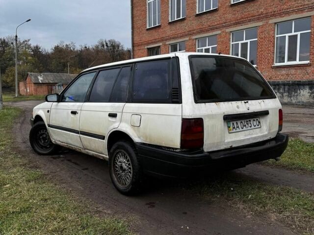 Белый Мазда 323, объемом двигателя 1.7 л и пробегом 100 тыс. км за 500 $, фото 2 на Automoto.ua