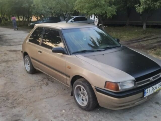 Бежевый Мазда 323, объемом двигателя 1.3 л и пробегом 323 тыс. км за 1500 $, фото 6 на Automoto.ua